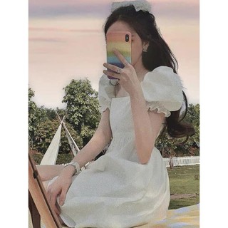 Đầm trắng tay phồng cột nơ sau