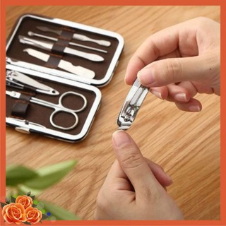 Bộ bấm móng tay 7 món : kéo + nhíp nhổ + cây ráy tai + bấm móng tay + cây lấy khoé móng tay chân