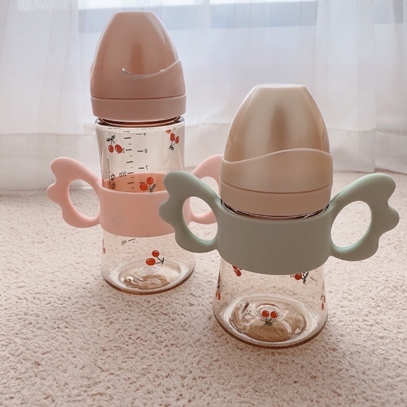 Tay Cầm Bình Sữa Cánh Tiên