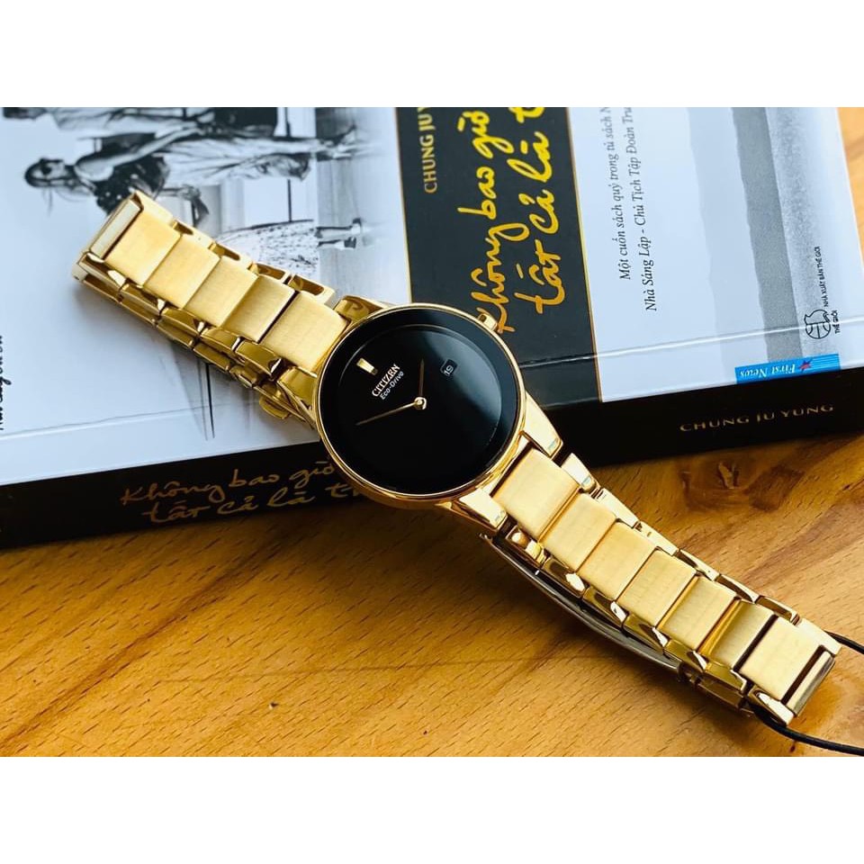 Đồng hồ Nữ Citizen Eco Drive GA1052-55E Mặt đen,Lịch ngày-Năng lượng ánh sáng-Dây kim loại mạ vàng cao cấp-Size 30mm
