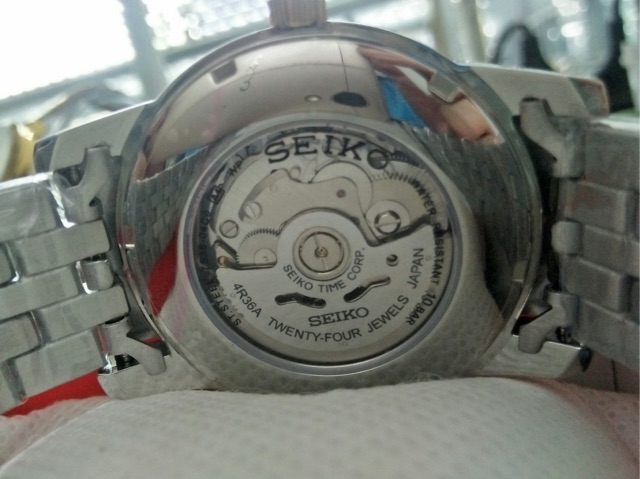 Đồng hồ cơ Seiko Nam lộ máy dây kim loại mặt trắng