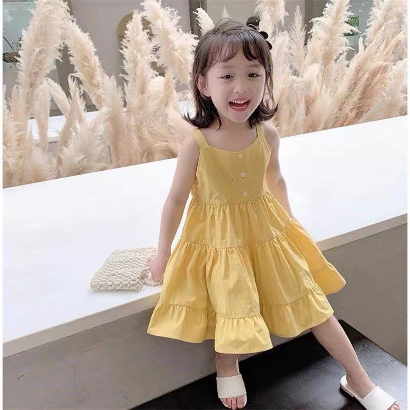 Váy vàng cam xoè tầng cho bé gái