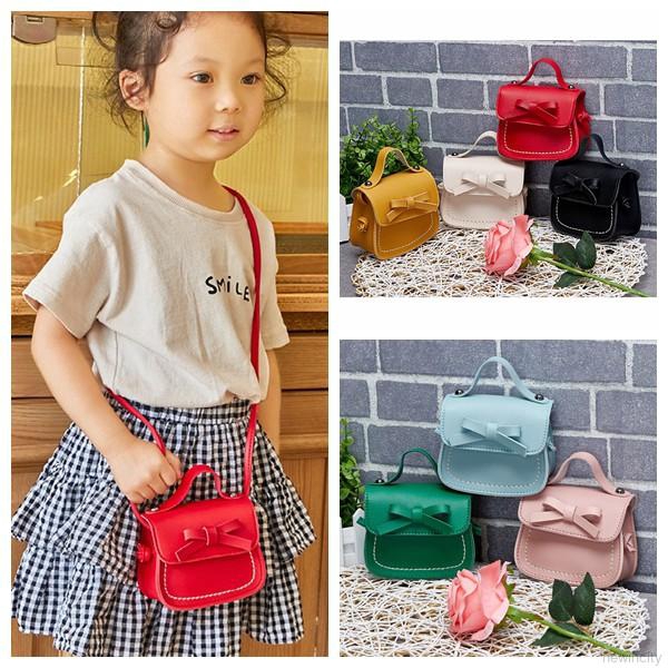 Túi đeo chéo mini đính nơ dễ thương cho bé gái