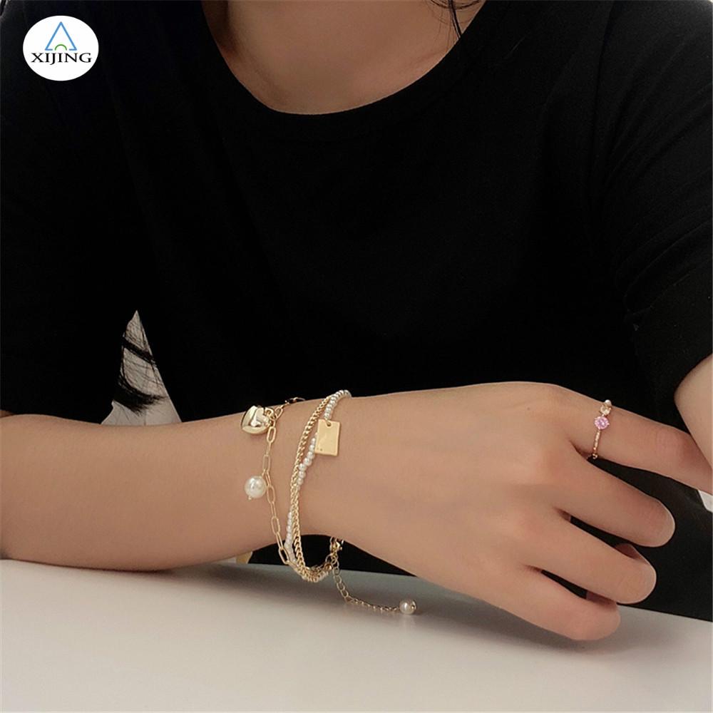 Vòng đeo tay đính ngọc trai nhân tạo thiết kế đơn giản sang trọng