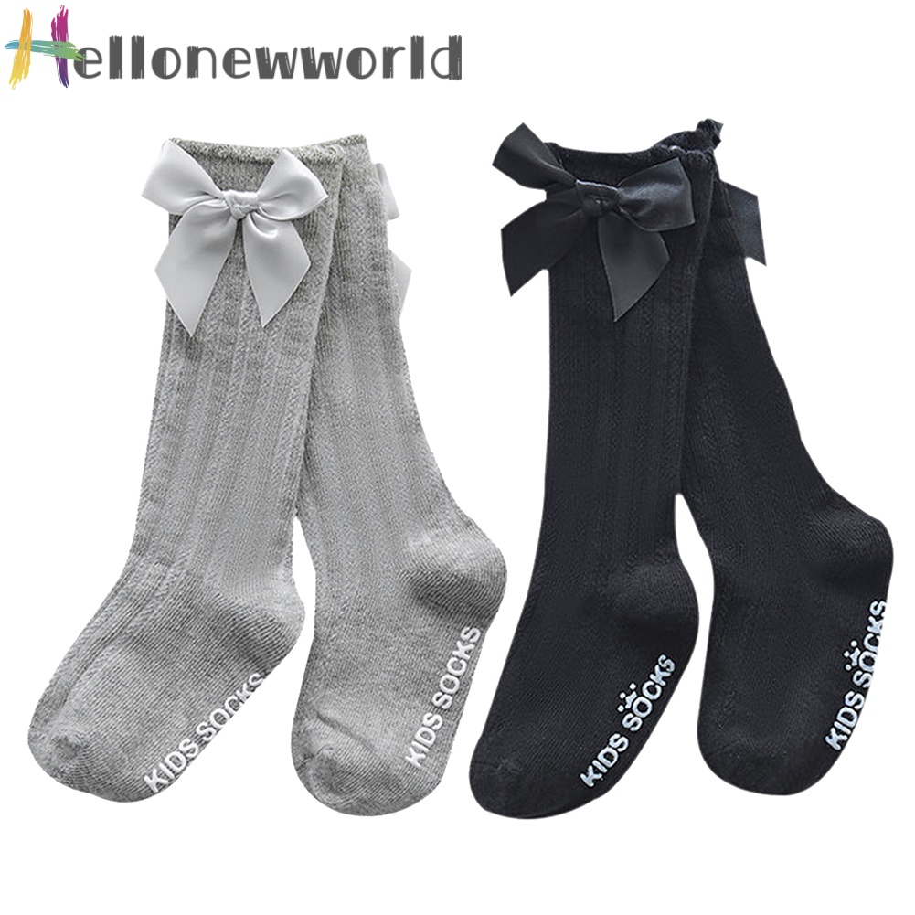 1 đôi vớ dài đến đầu gối giữ ấm chống trượt đính nơ dễ thương cho bé