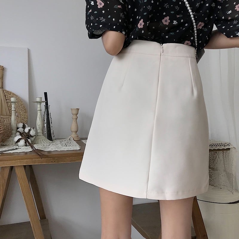 Chân váy chữ A ngắn xẻ cạnh màu trắng có quần trong(sẵn size)