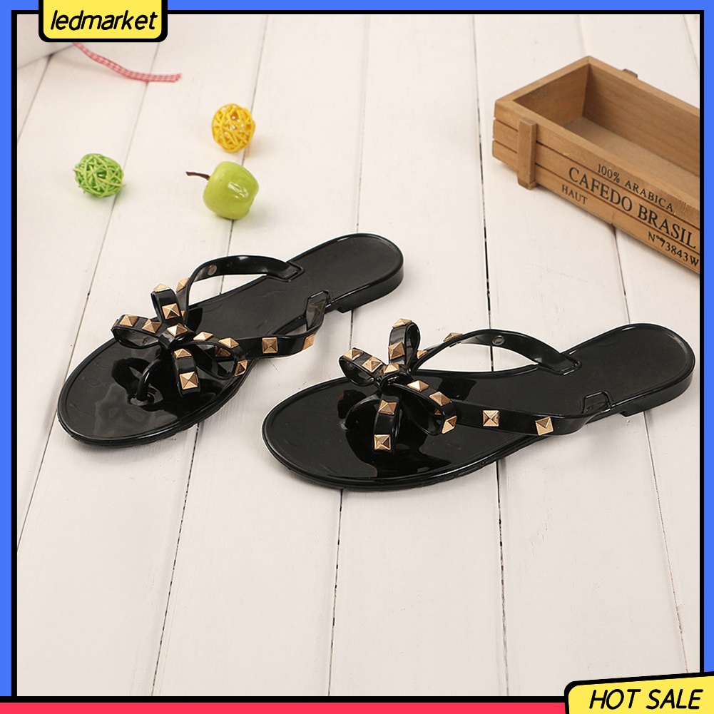 Dép đi biển phối nơ và đinh thời trang mùa hè dành cho nữ