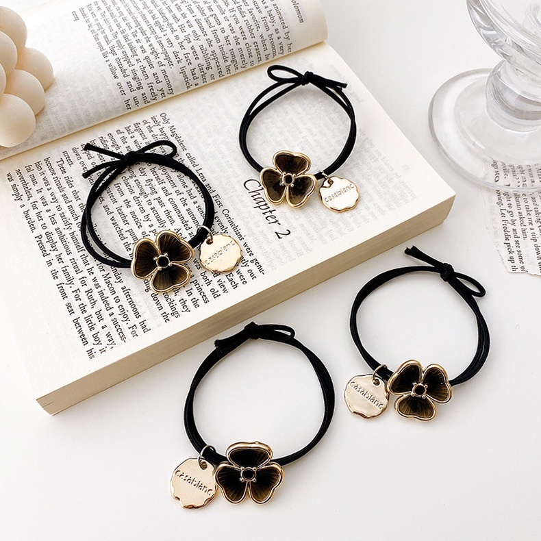 Dây buộc tóc co giãn mặt hình cỏ ba lá thời trang dành cho nữ