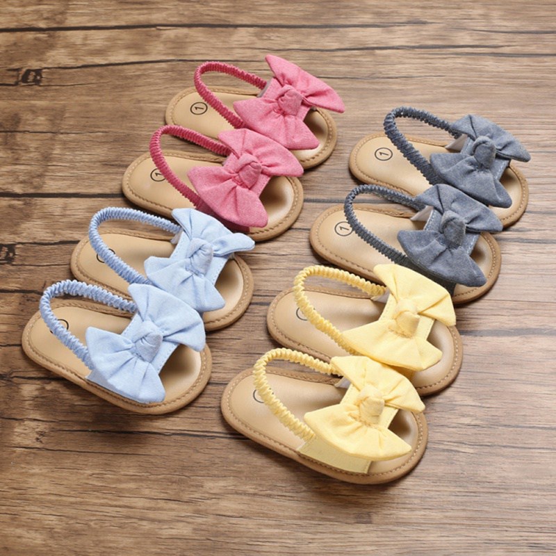 Giày sandal tập đi đính nơ chất liệu vải chống trượt xinh xắn thời trang mùa hè dành cho bé gái sơ sinh