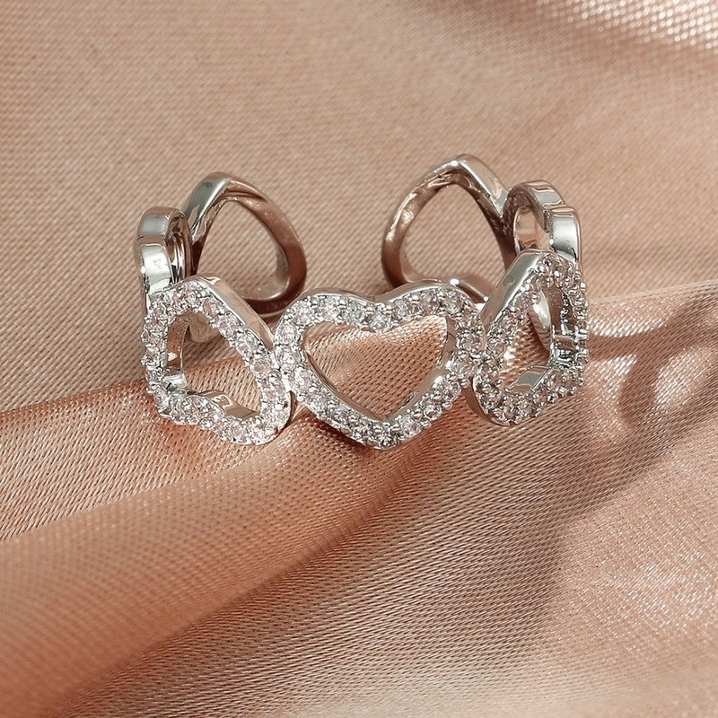 Elegant open-cut heart-shaped ring with zircon stones for women