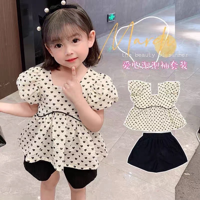 set bộ trắng babydoll chấm bi trái tim tay bồng quần sooc đen cho bé gái