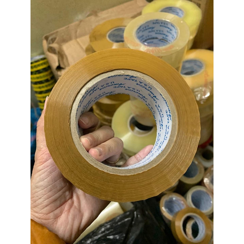 Băng keo đục 100y ( 1 cuộn) siêu dính để dán thùng giấy carton đóng hàng giá rẻ tận xưởng giao hỏa tốc nhận hàng ngay