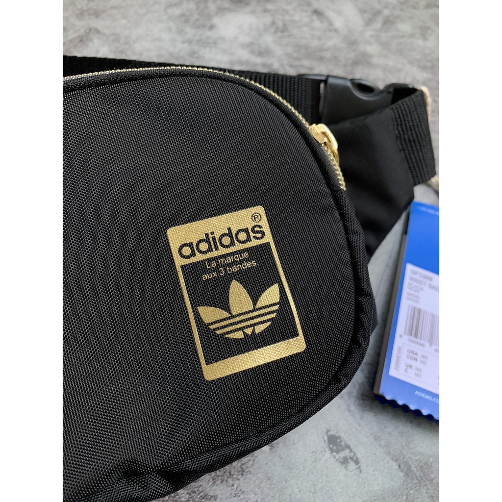 (THAILAND XUẤT XỊN) Túi bao tử das đen logo vàng, khóa vàng Adidas Originals Superstar Waist Bag Black/Gold GF3200