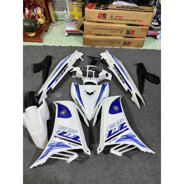 Áo Exciter 135 Trắng Xanh