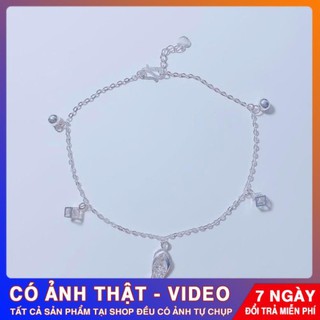 lắc chân chiếc dép bạc
