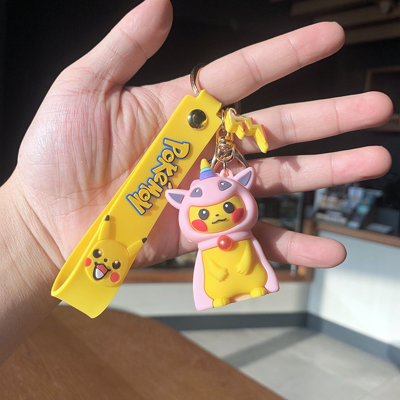 the creative personality of pikachu schobag around plastic plastic plastic dolls in the car with the keys of his necklace.