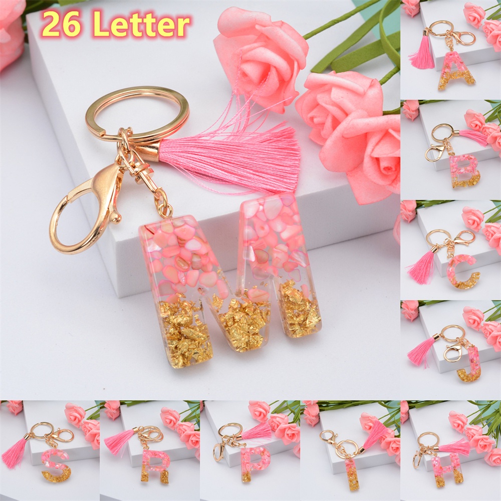 Móc khóa nhựa resin hình 26 chữ cái màu hồng phối tua rua dễ thương