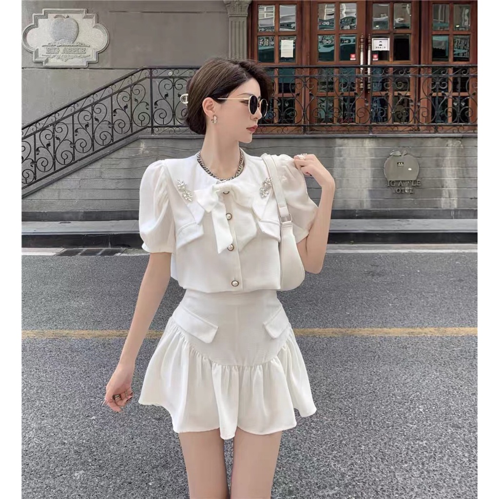 Sét chân váy xòe, áo cổ vest đính nơ tay phồng thiết kế cao cấp thời trang công sở, dự tiệc sang trọng V112 | BigBuy360 - bigbuy360.vn