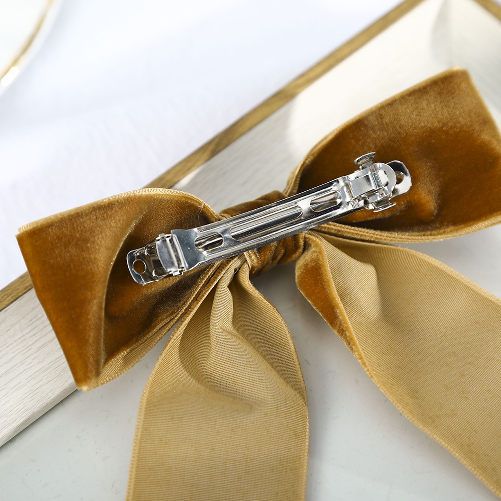 Kẹp tóc Haimeikang gắn nơ đính ngọc trai bằng