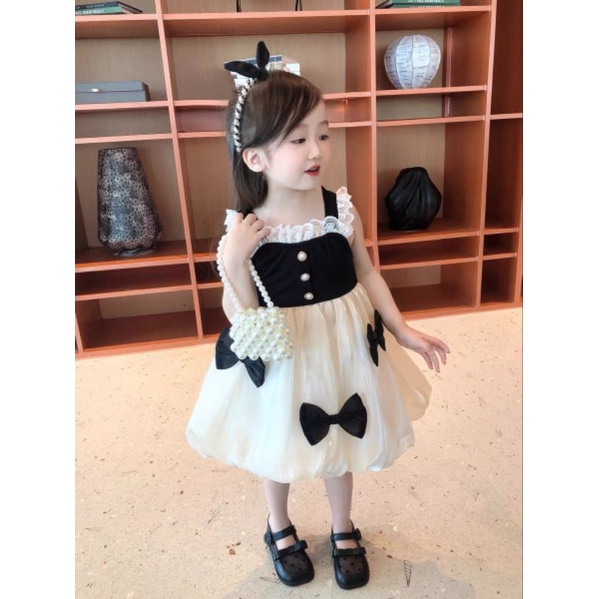 Váy  bé gái - Đầm công chúa 2 dây đính nơ phong cách Hàn Quốc siêu xinh