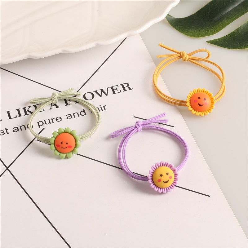 Dây buộc tóc hoa mặt cười xinh xắn  Clovershop68