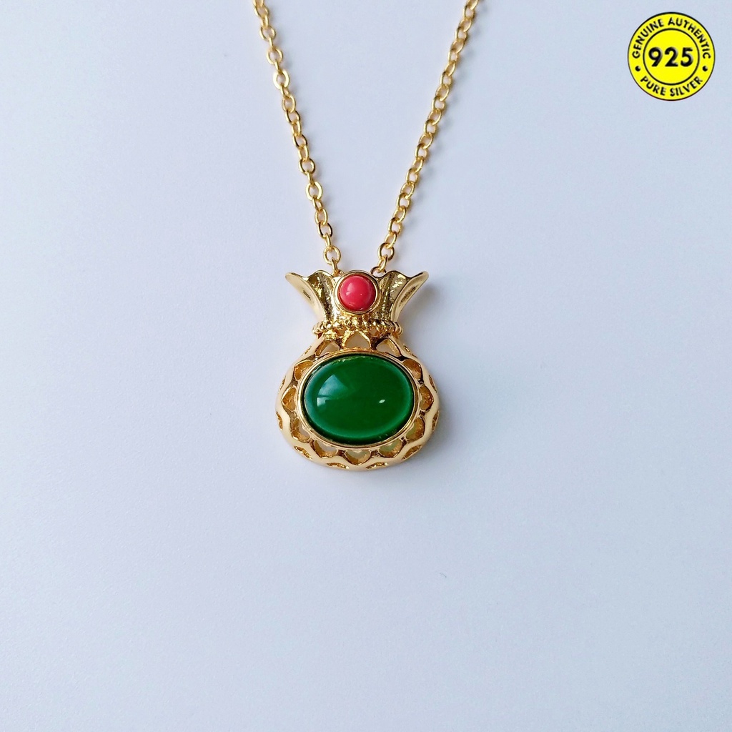 Dây chuyền may mắn hình túi xách đính ngọc lục bảo