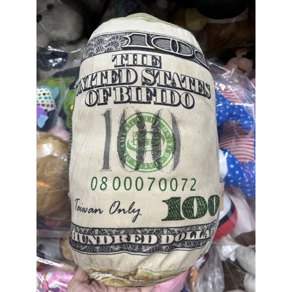 Gấu bông gối tiền dollar