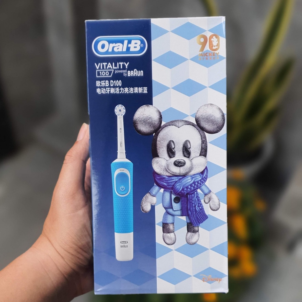 Bàn chải điện đánh răng tự động Oral B D100 hồng làm sạch răng, hạn chế viêm nướu