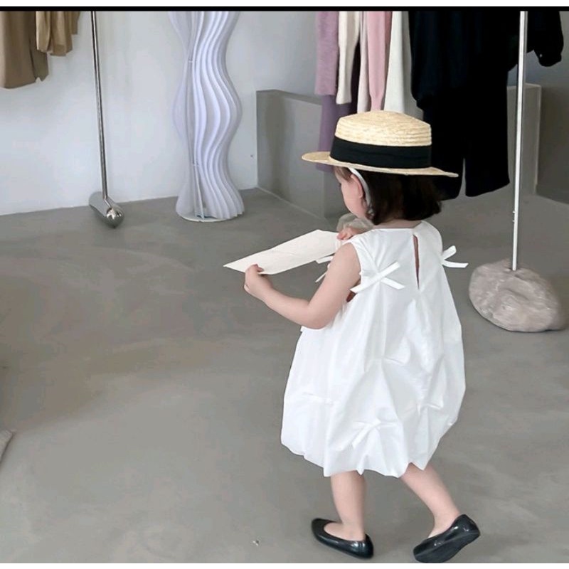 Đầm bí trắng nơ nhí