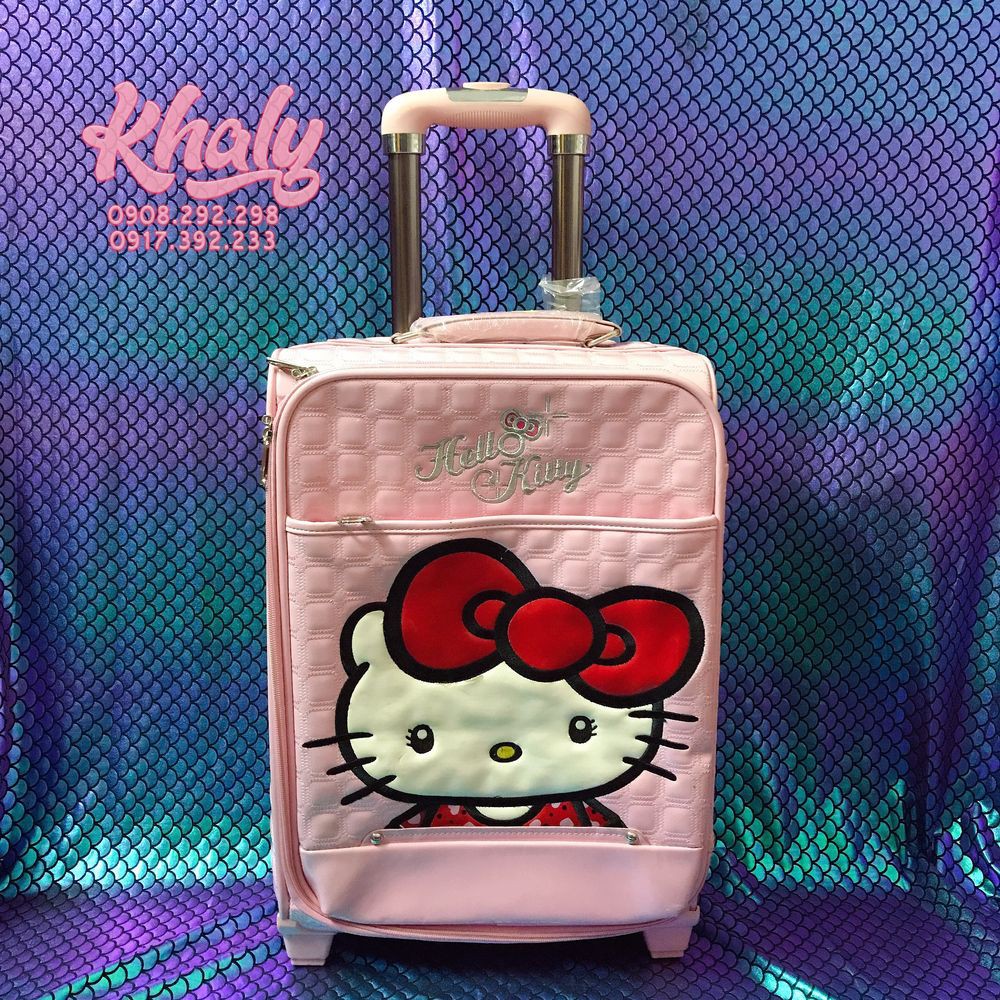 Vali kéo du lịch trẻ em 20'' hình mèo Hello Kitty nơ đỏ da bóng màu hồng siêu đáng yêu dành (dính chút lỗi nhẹ nên SALE)