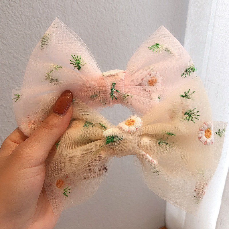 K70 Kẹp nơ hoa cúc lá xanh vải lưới