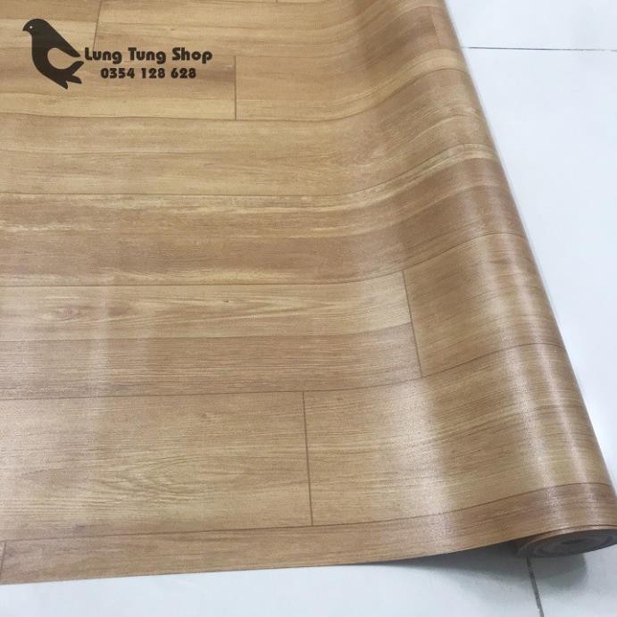 Thảm nhựa simili trải sàn vân gỗ màu vàng bề mặt nhám