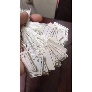 100 tem ghi tên và giá, sản tem viền vàng có chỉ buộc sẳn