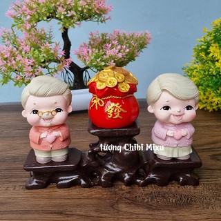 Bộ 02 tượng Ông Bà chibi kèm túi chữ Phát và chân đế tam cấp vuông nhỏ