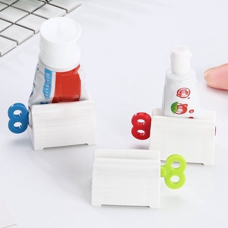 Giá đỡ cuộn kem đánh răng tiết kiệm tiện lợi