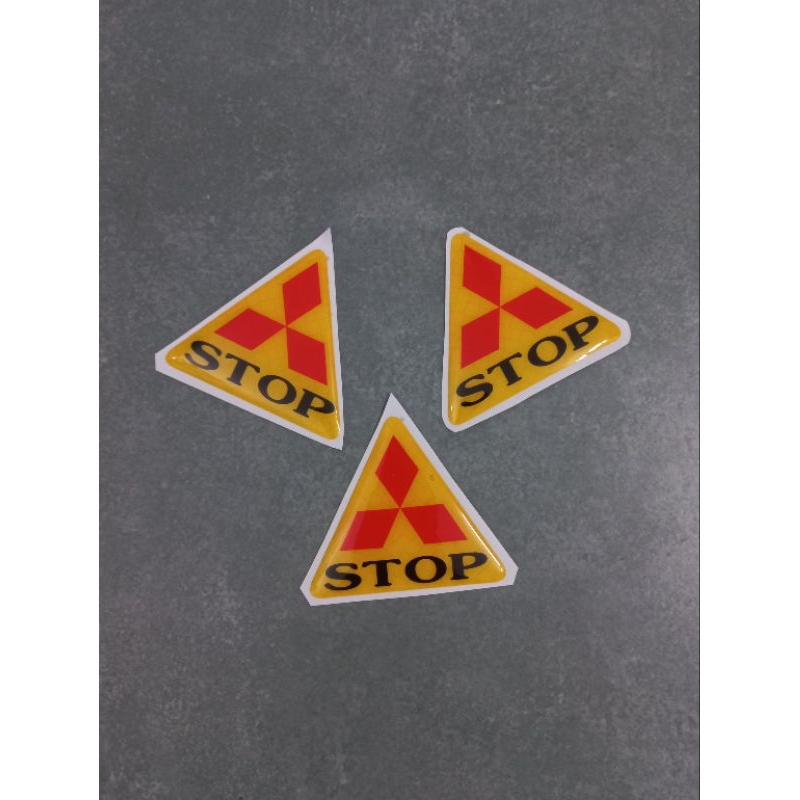 Tem nổi tam giác chữ Stop 6cm dán đuôi dè xe máy