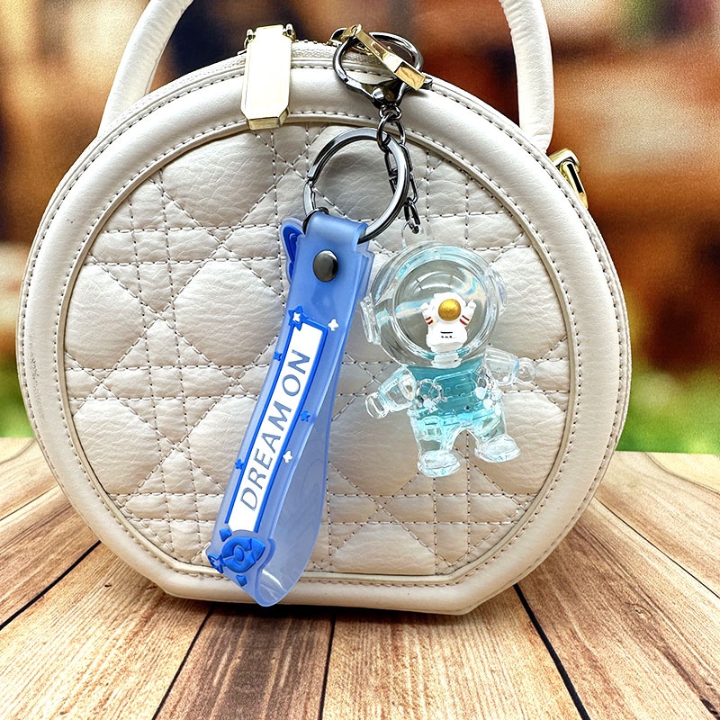 Móc Khóa Hình Chai Nước Phi Hành Gia Trong Suốt Lấp Lánh