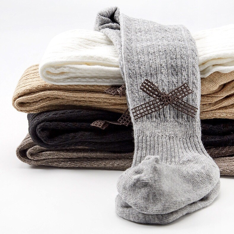 Quần tất len đính nơ cho bé gái mềm và ấm, trơn màu, co giãn 4 chiều size từ 1 đến 12 tuổi