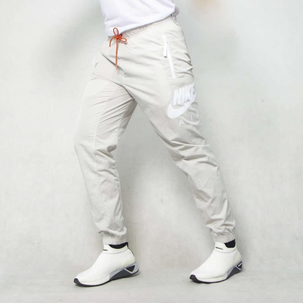 QUẦN DÀI NIKE NIKE AIR WOVEN GET OVR YOUR FEAR OF HEIGHTS JOGGER PANT - BEIGE