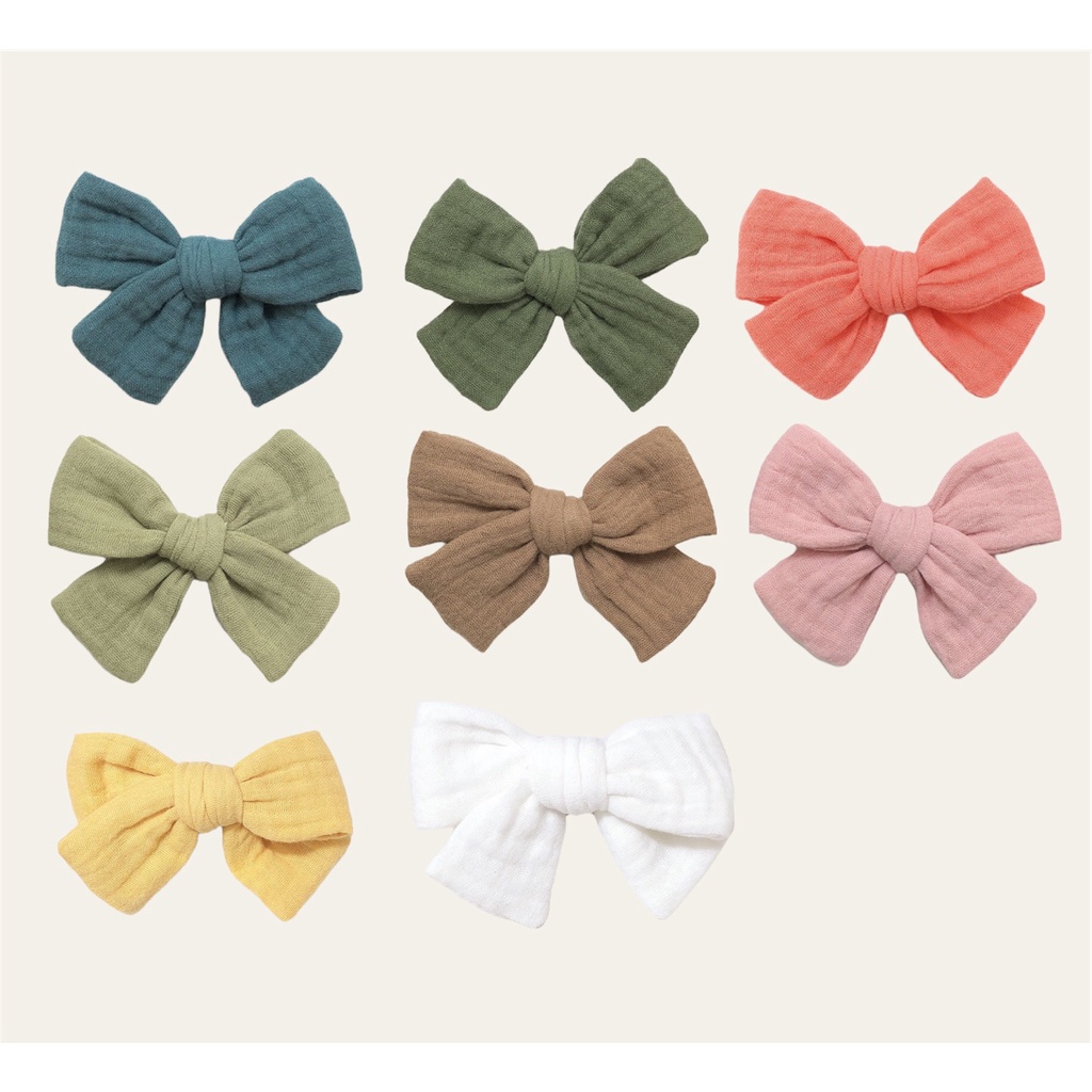 Băng đô hoặc kẹp nơ màu trơn cho bé