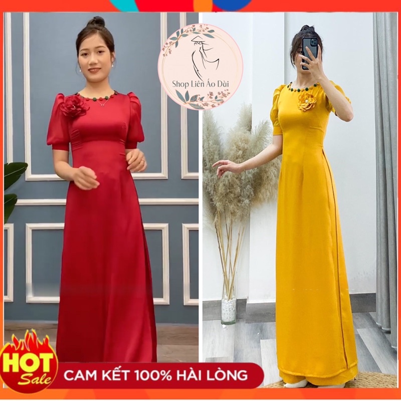 Áo dài cách tân cổ tròn tay ngắn cổ có đính cúc bọc, phần thân đính hoa cùng màu áo, áo dài may sẵn