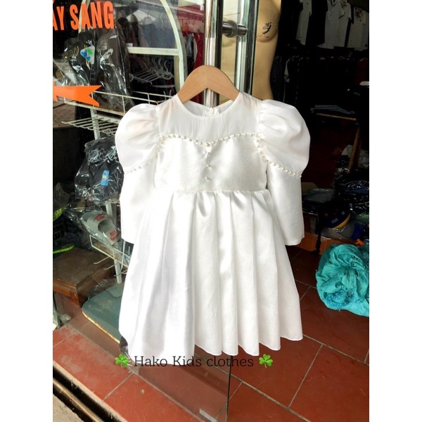Váy trắng tay bồng đính ngọc hk bé gái