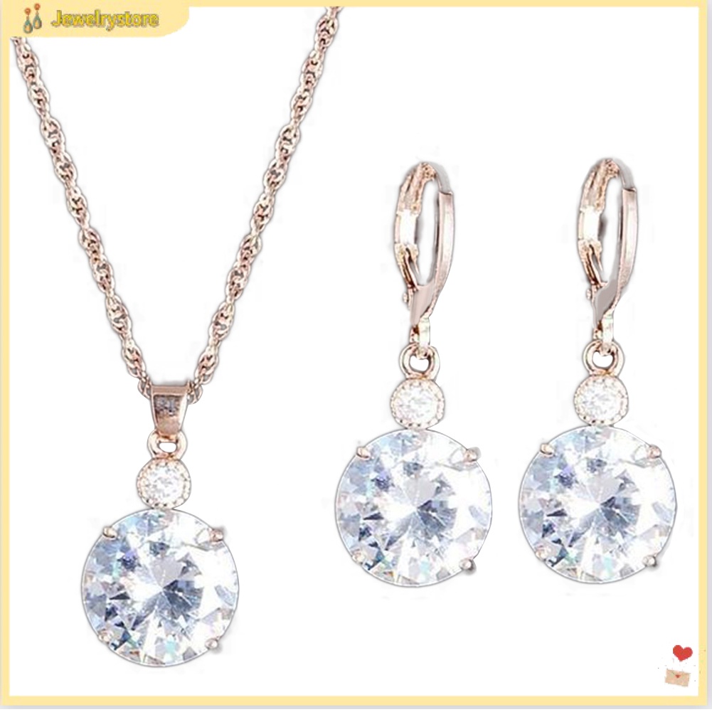 {jewelrystore} Bộ trang sức gồm dây chuyền mặt hình tròn và bông tai đính đá pha lê sang trọng