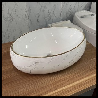 Chậu rửa mặt - Lavabo elip hoa văn vân đá vàng cao cấp, kích thước 50x31cm.