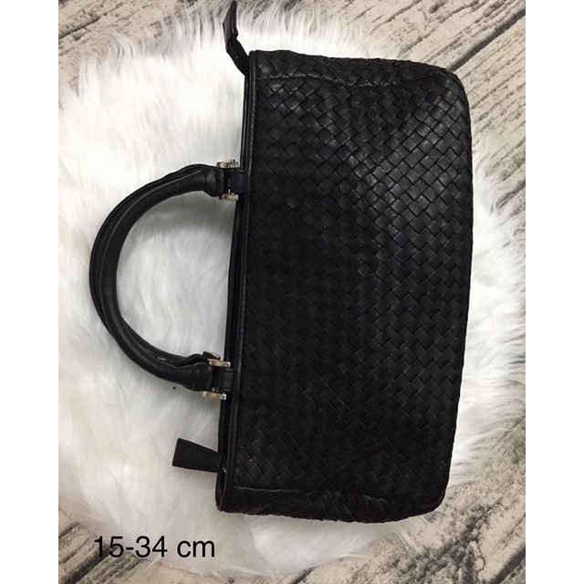 Túi cầm tay da đan