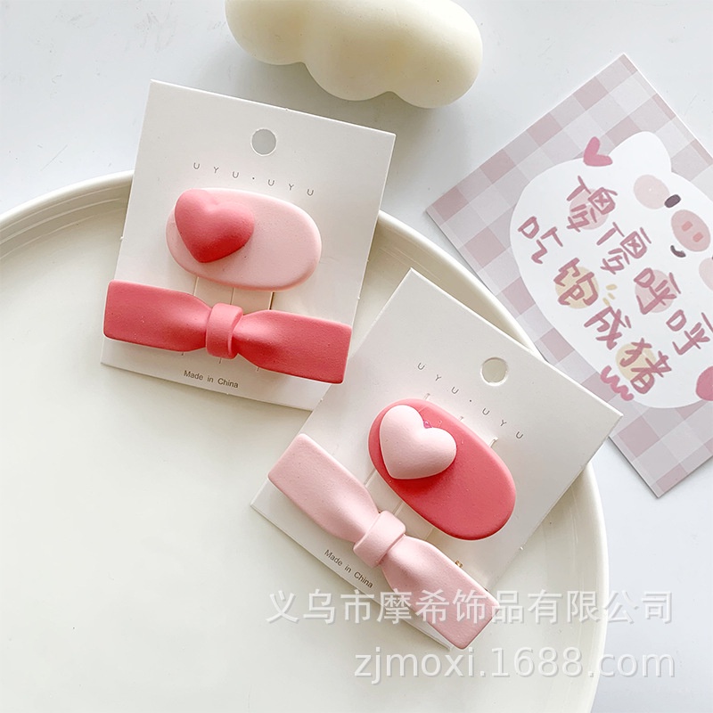 Kẹp tóc nơ trái tim hồng thời trang phong cách Hàn Quốc cho bé