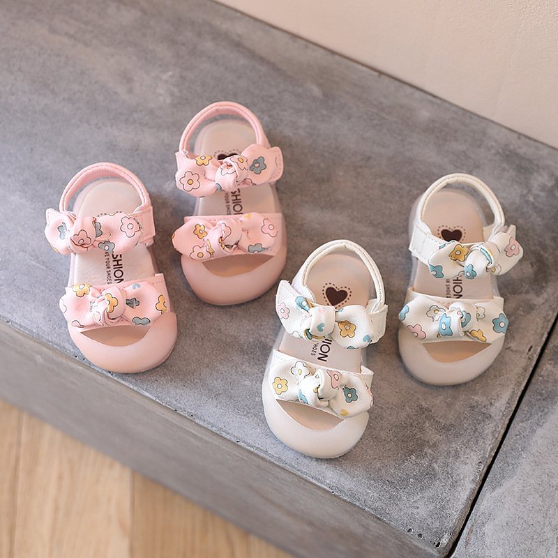 Dép sandal tập đi cho bé gái, quai hậu trẻ em gái đính nơ quai dán ngang chống trơn chống vấp cho bé từ 0- 3 tuổi