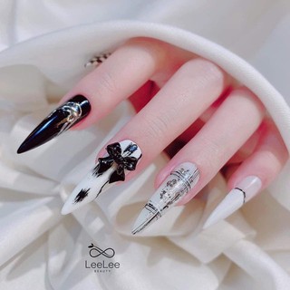 Mẫu nailbox nhọn dài đen trắng gắn charm nơ