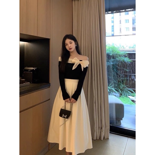 Sét Áo Đen Len Tăm Trễ Vai Nơ Phối Chân Váy Be Dài Xếp Li