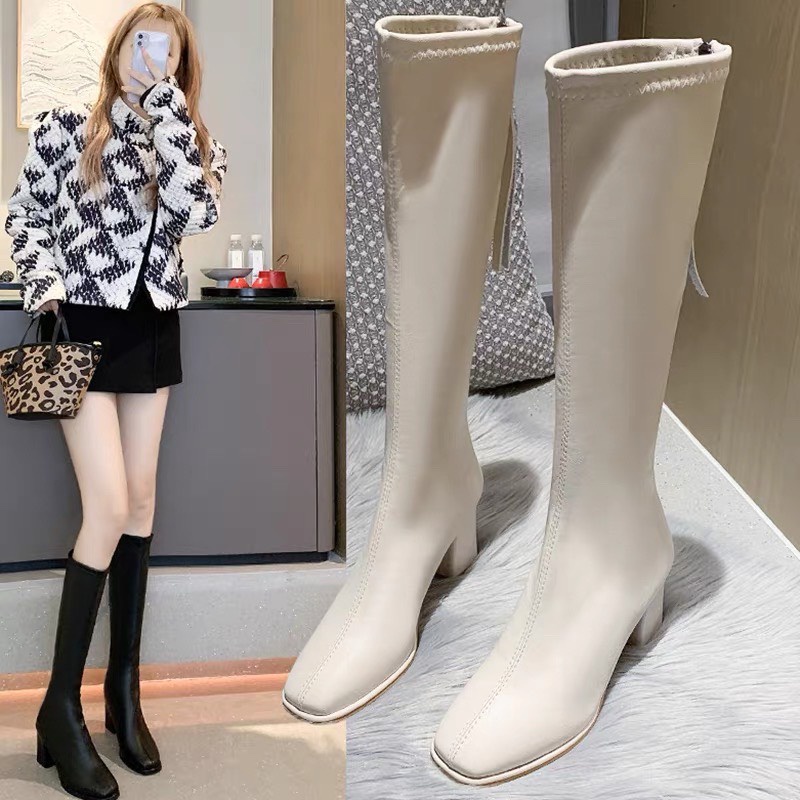 Bốt đùi nữ khóa tua rua dài sau gót cao 7 phân